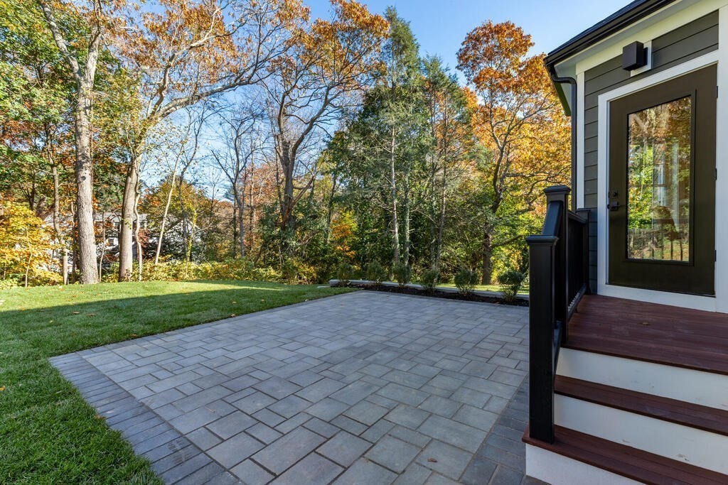 445 Lowell Street Lexington, MA 02420 - Photo 34 of 41 a view of a yard with an outdoor space