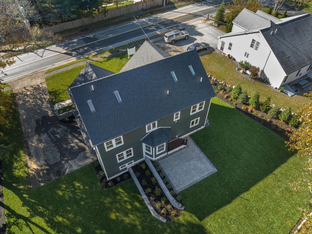 445 Lowell Street Lexington, MA 02420 - Photo 38 of 41 an aerial view of a house with a garden