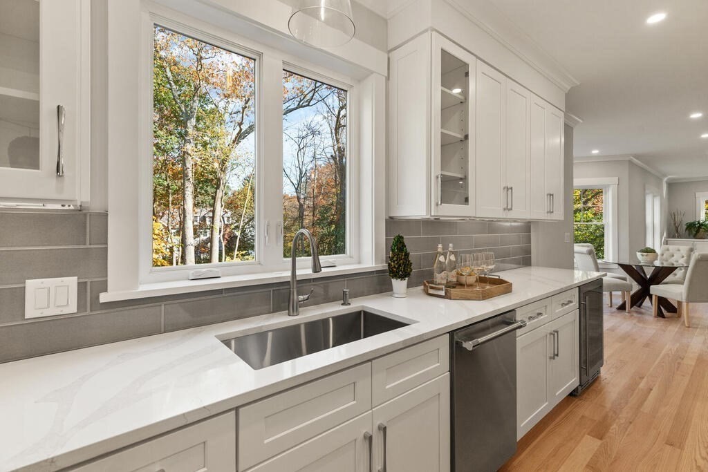445 Lowell Street Lexington, MA 02420 - Photo 5 of 41 a kitchen with a sink and large window