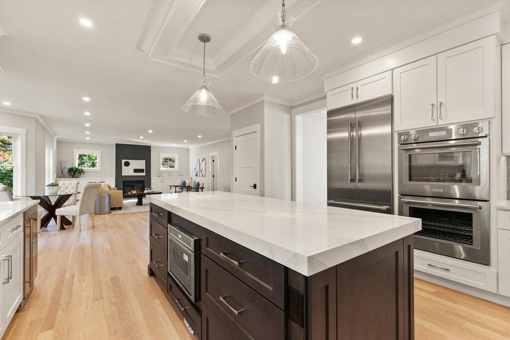 445 Lowell Street Lexington, MA 02420 - Photo 6 of 41 a large kitchen with stainless steel appliances a large counter top