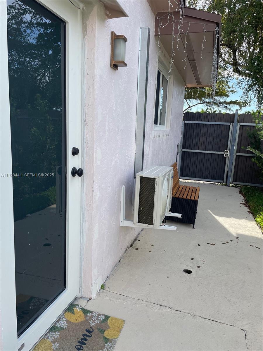 14121 Kendale Lakes Boulevard, Unit 14121 Miami, FL 33183 - Photo 1 of 9 an outdoor space with patio