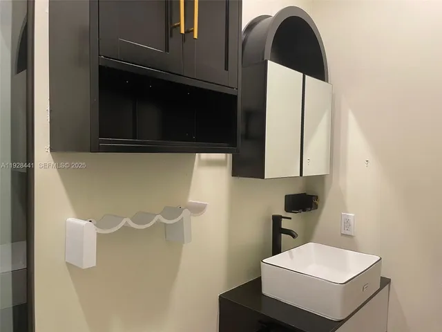 a bathroom with a sink and a mirror