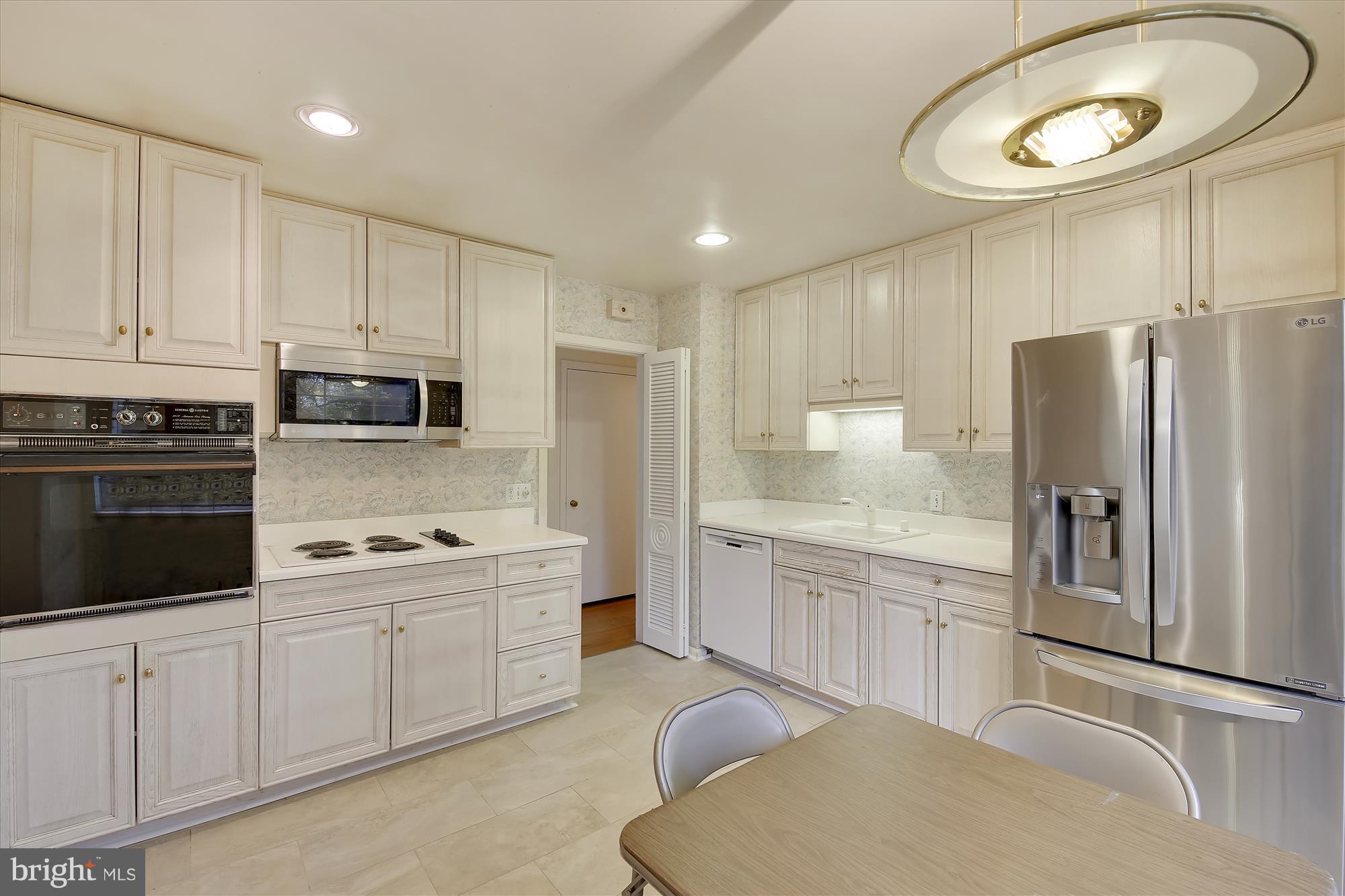 1900 Ladd Street Silver Spring, MD 20902 - Photo 10 of 36 Kitchen W/Stainless Steel Refrigerator & Microwave