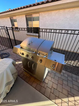 a view of barbeque area with wooden floor