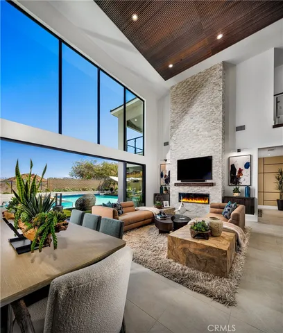 a living room with furniture fireplace and flat screen tv