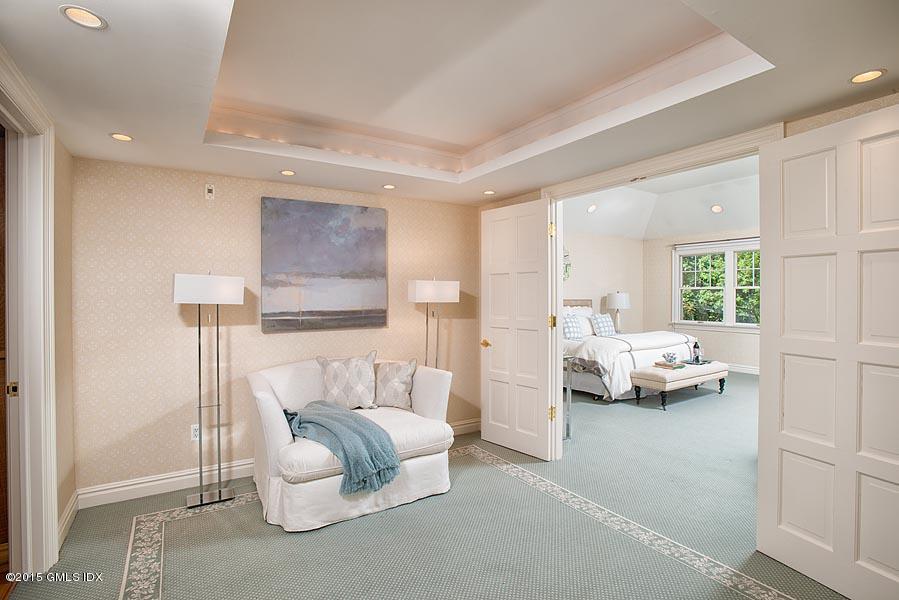 122 Clapboard Ridge Road Greenwich, CT 06830 - Photo 18 of 39 a bedroom with furniture and a window