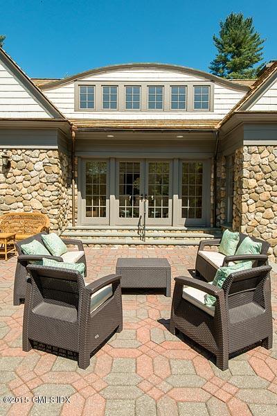 122 Clapboard Ridge Road Greenwich, CT 06830 - Photo 23 of 39 a swimming pool with outdoor seating and barbeque oven