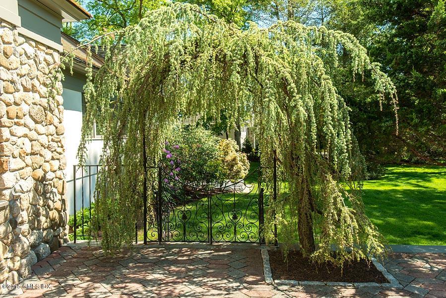 122 Clapboard Ridge Road Greenwich, CT 06830 - Photo 24 of 39 a view of a yard with plants and trees