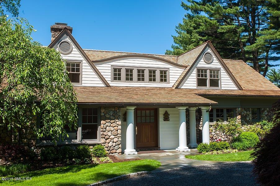 122 Clapboard Ridge Road Greenwich, CT 06830 - Photo 4 of 39 a front view of a house with a yard