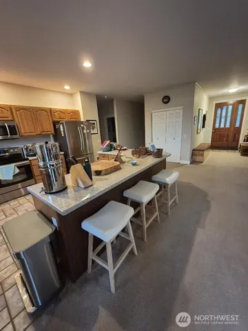 a bathroom with a shower sink and mirror