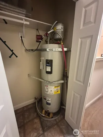 a living room with lots of furniture and clutter