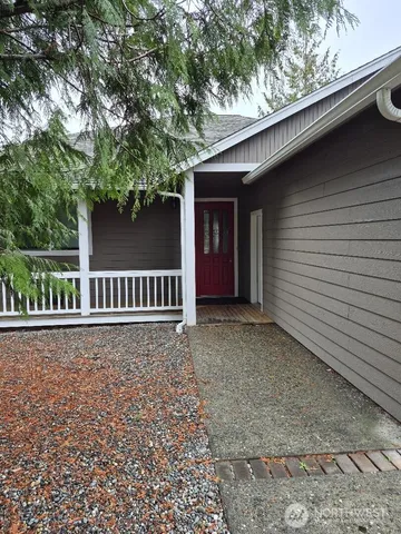 a backyard of a house with a tree