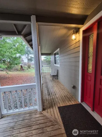 a view of a balcony with wooden floor