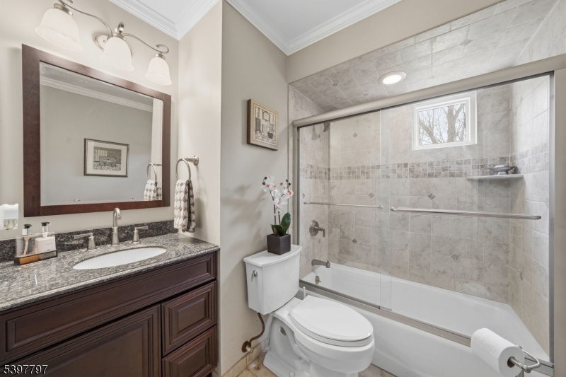 5 Glen Gate Road Boonton, NJ 07005 - Photo 14 of 46 a bathroom with a granite countertop toilet a sink and a bathtub