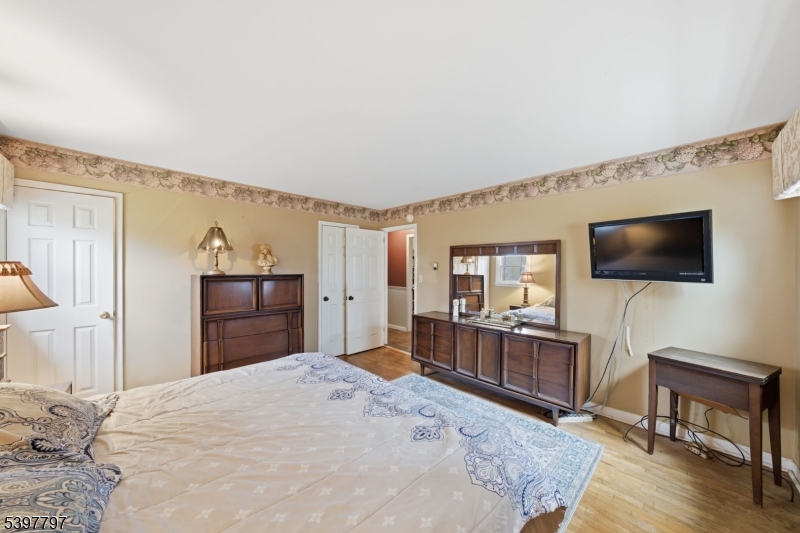 5 Glen Gate Road Boonton, NJ 07005 - Photo 16 of 46 a bedroom with furniture and flat screen tv