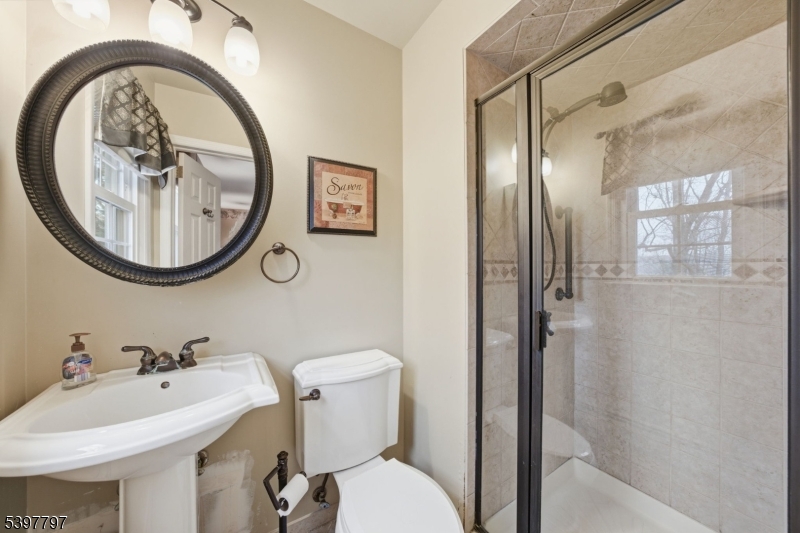 5 Glen Gate Road Boonton, NJ 07005 - Photo 17 of 46 a bathroom with a sink and a mirror