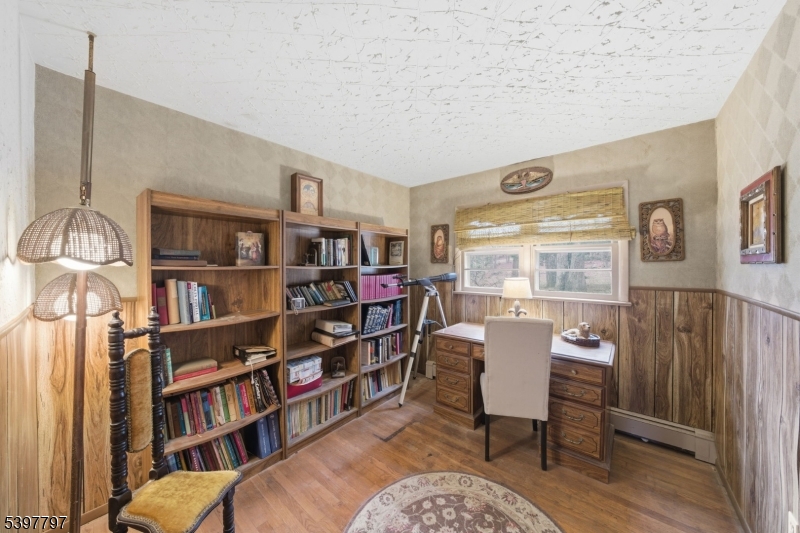 5 Glen Gate Road Boonton, NJ 07005 - Photo 18 of 46 a living room with furniture and a book shelf