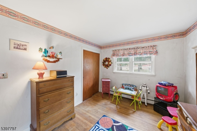 5 Glen Gate Road Boonton, NJ 07005 - Photo 20 of 46 a living room with furniture and a table