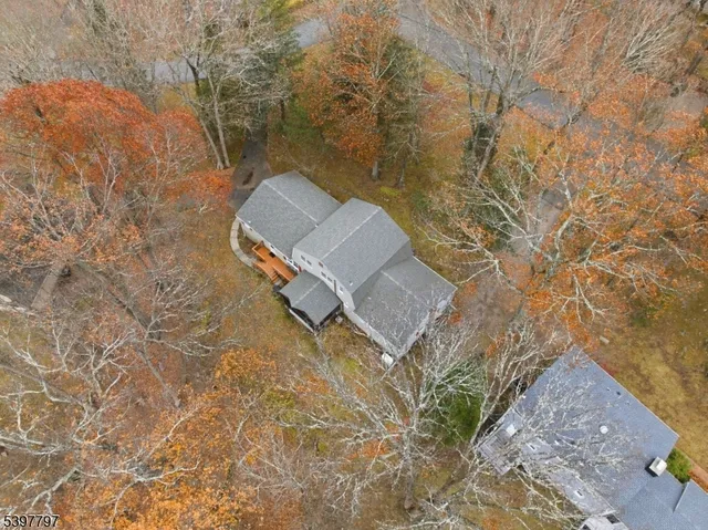a aerial view of a house with a yard