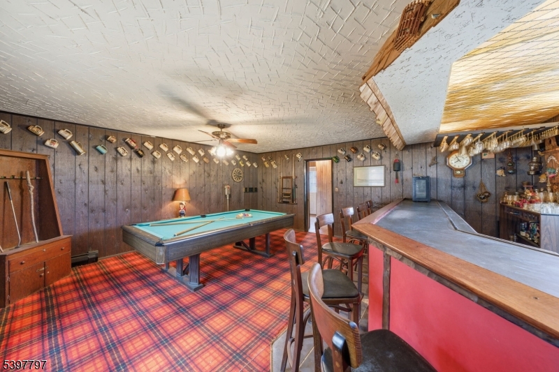 5 Glen Gate Road Boonton, NJ 07005 - Photo 23 of 46 a room with wooden furniture and a table