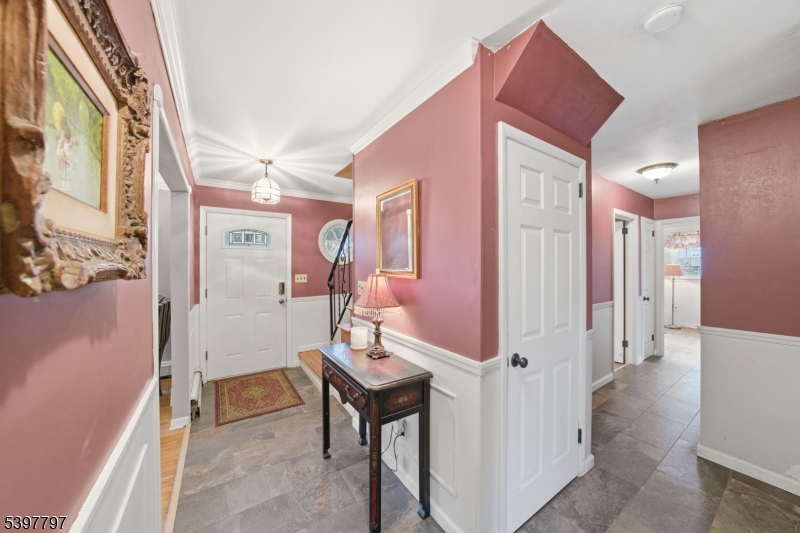 5 Glen Gate Road Boonton, NJ 07005 - Photo 24 of 46 a view of a hallway with a dining table and chairs