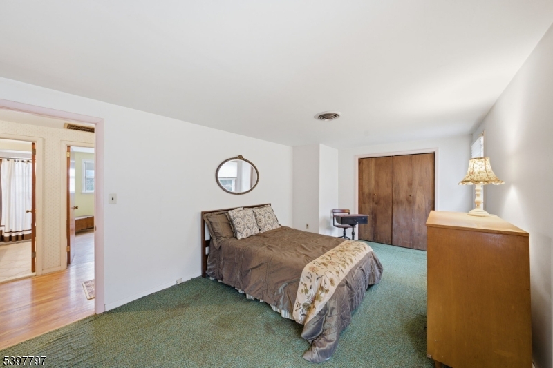 5 Glen Gate Road Boonton, NJ 07005 - Photo 26 of 46 a bedroom with a bed and wooden floor