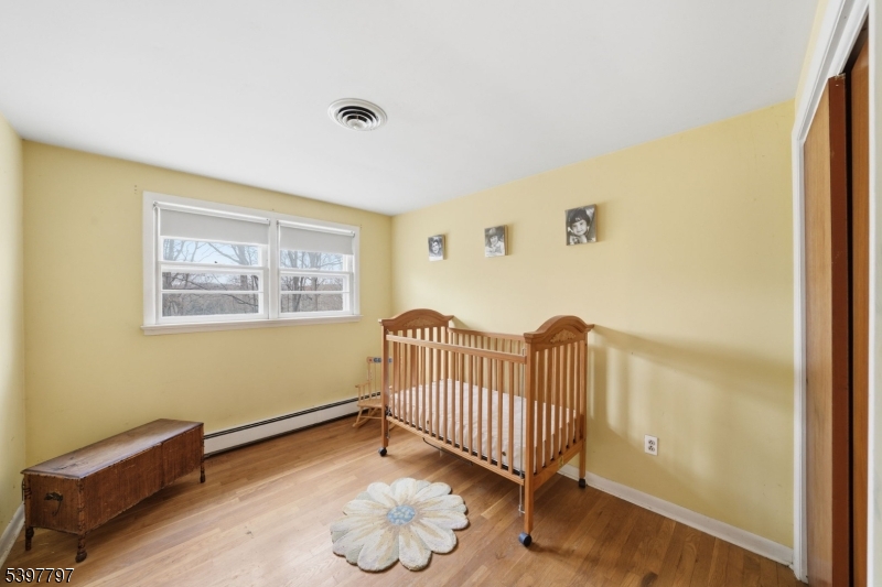 5 Glen Gate Road Boonton, NJ 07005 - Photo 30 of 46 a view of a room with wooden floor a ceiling fan and windows
