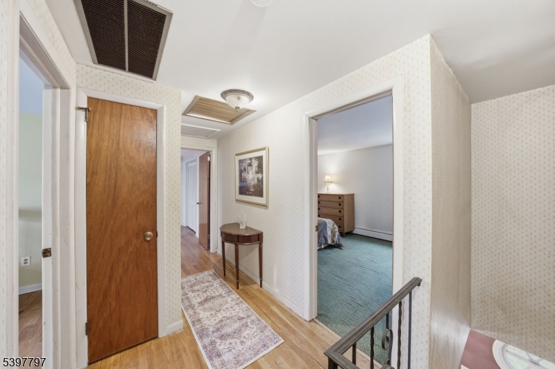 5 Glen Gate Road Boonton, NJ 07005 - Photo 32 of 46 a view of a hallway with a livingroom and furniture