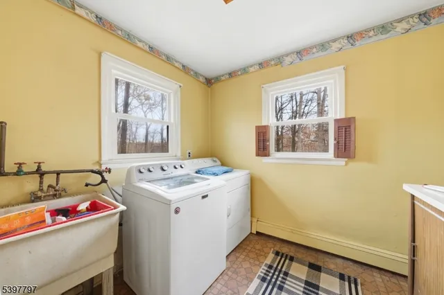 a utility room with a stove and a window