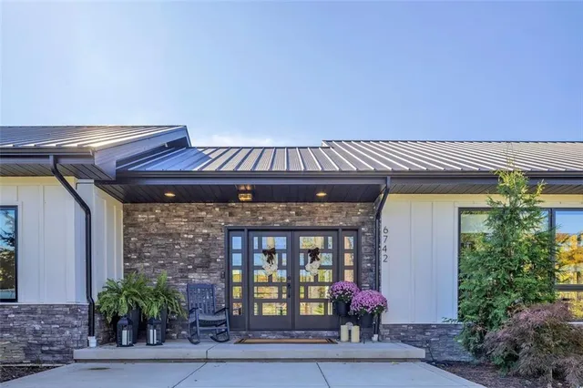 a front view of a house with garden