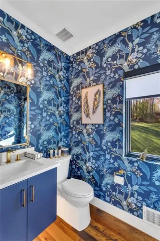 a bathroom with a toilet and a sink