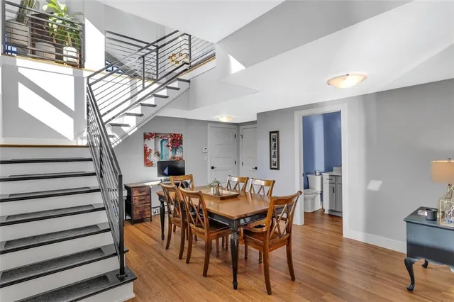 a view of a dining room with furniture and wooden floor