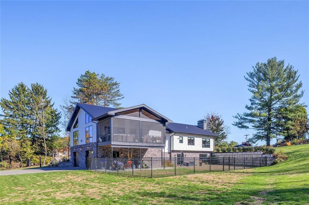 6742 Old Mars Crider Road Cranberry Township, PA 16066 - Photo 44 of 50 a front view of a house with a yard table and chairs