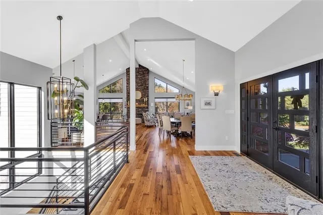 a view of a living room kitchen and a wooden floor