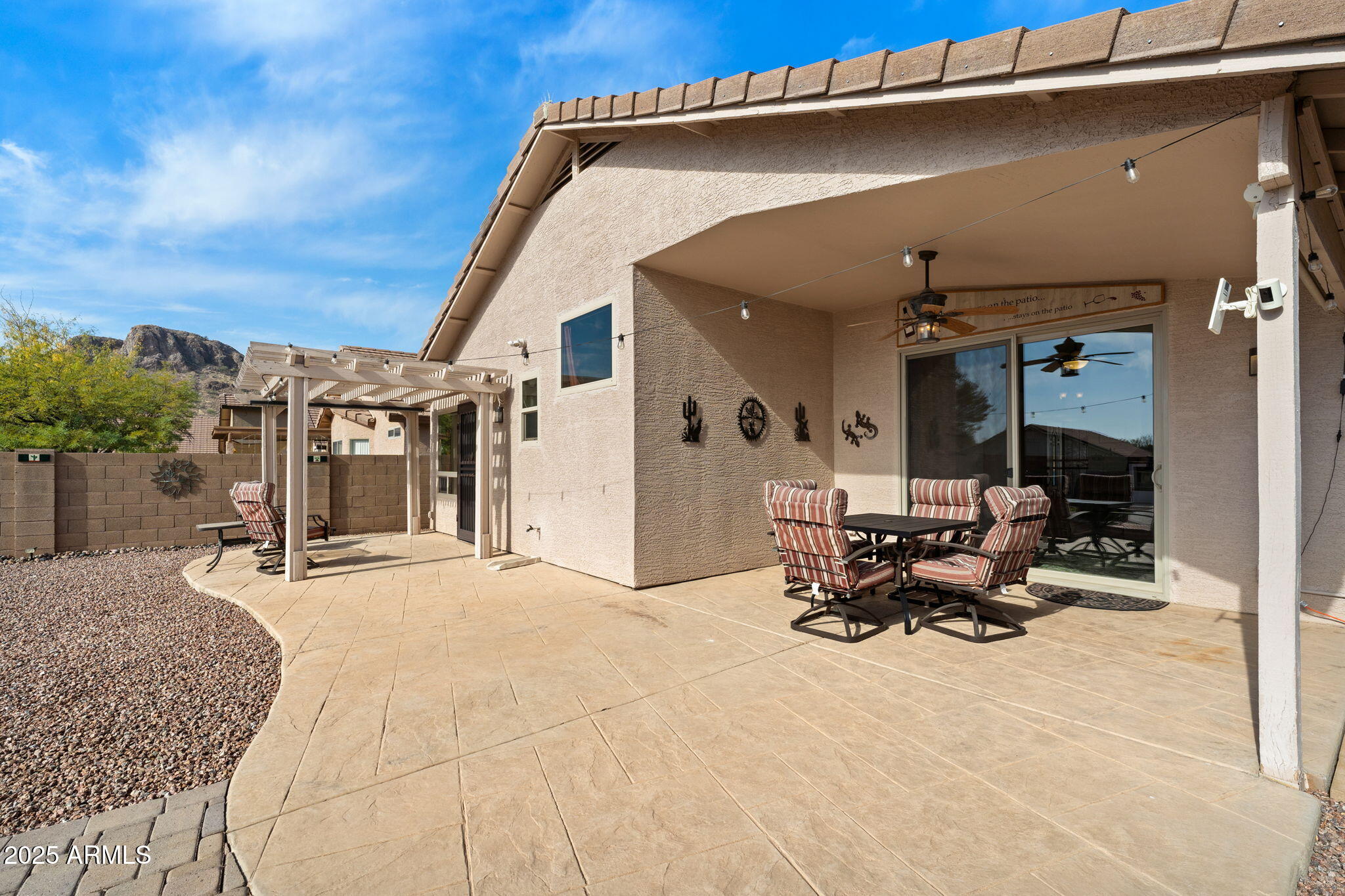 10363 East Rising Sun Place Gold Canyon, AZ 85118 - Photo 14 of 23 a view of a patio with table and chairs under an umbrella
