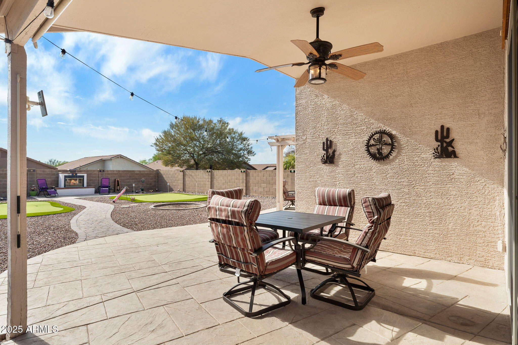10363 East Rising Sun Place Gold Canyon, AZ 85118 - Photo 15 of 23 a view of a patio with a table and chairs