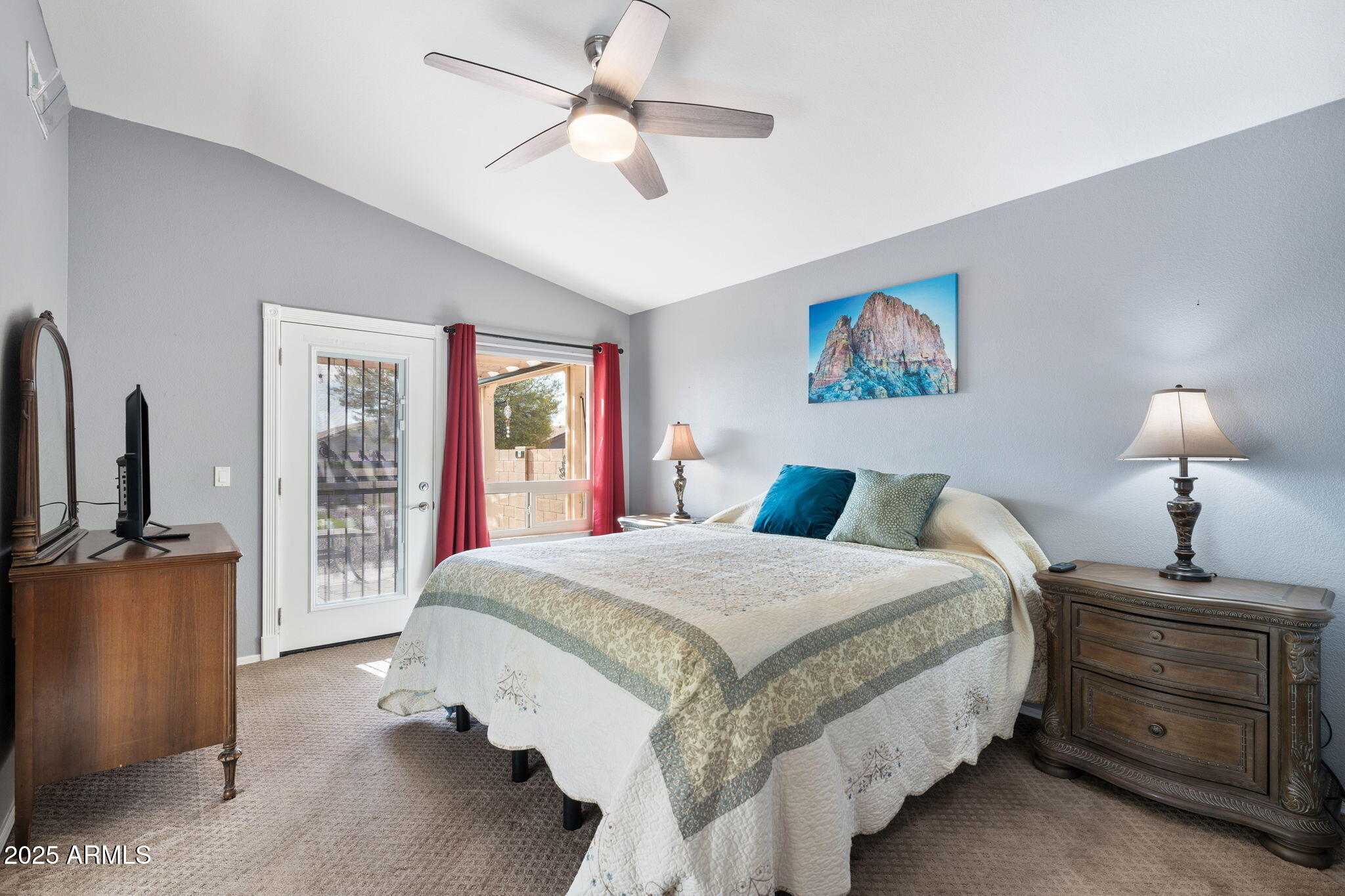 10363 East Rising Sun Place Gold Canyon, AZ 85118 - Photo 18 of 23 a bedroom with a large bed and a chandelier
