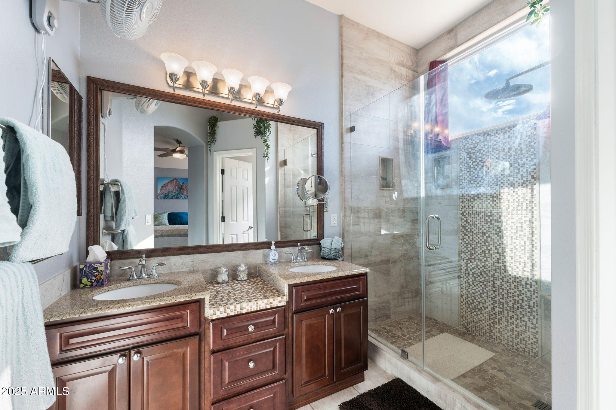 10363 East Rising Sun Place Gold Canyon, AZ 85118 - Photo 20 of 23 a bathroom with a granite countertop sink a mirror and a shower