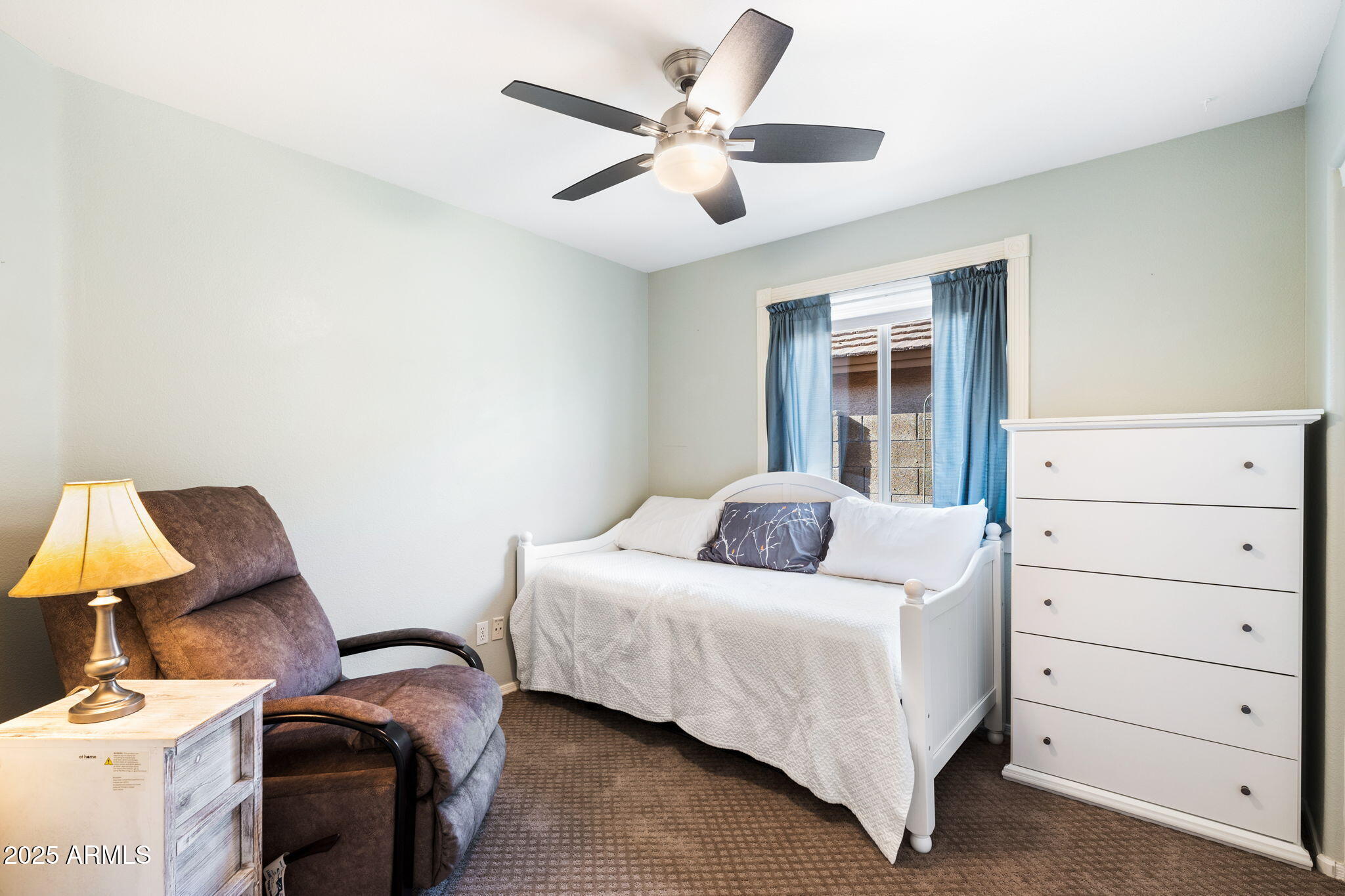 10363 East Rising Sun Place Gold Canyon, AZ 85118 - Photo 22 of 23 a room with a bed and a ceiling fan