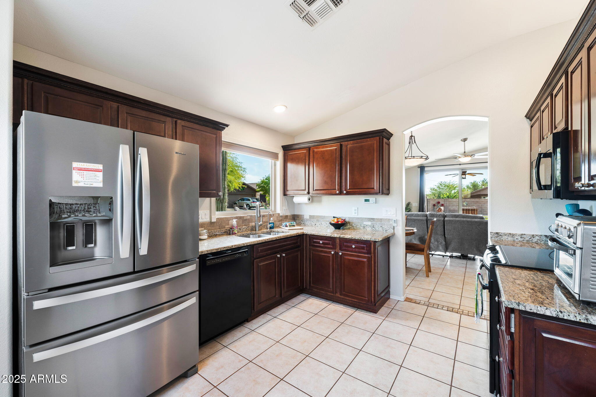 10363 East Rising Sun Place Gold Canyon, AZ 85118 - Photo 10 of 23 a kitchen with stainless steel appliances granite countertop a refrigerator and a stove top oven