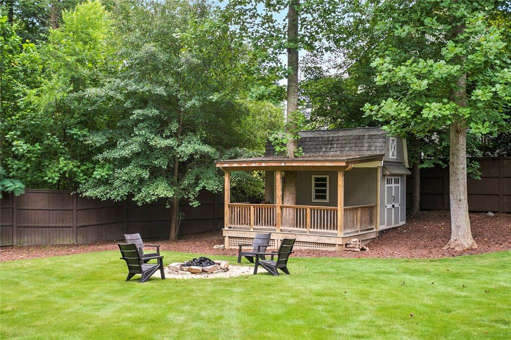 4000 Lower Roswell Road Marietta, GA 30068 - Photo 25 of 25 a view of a chair and table in backyard of the house