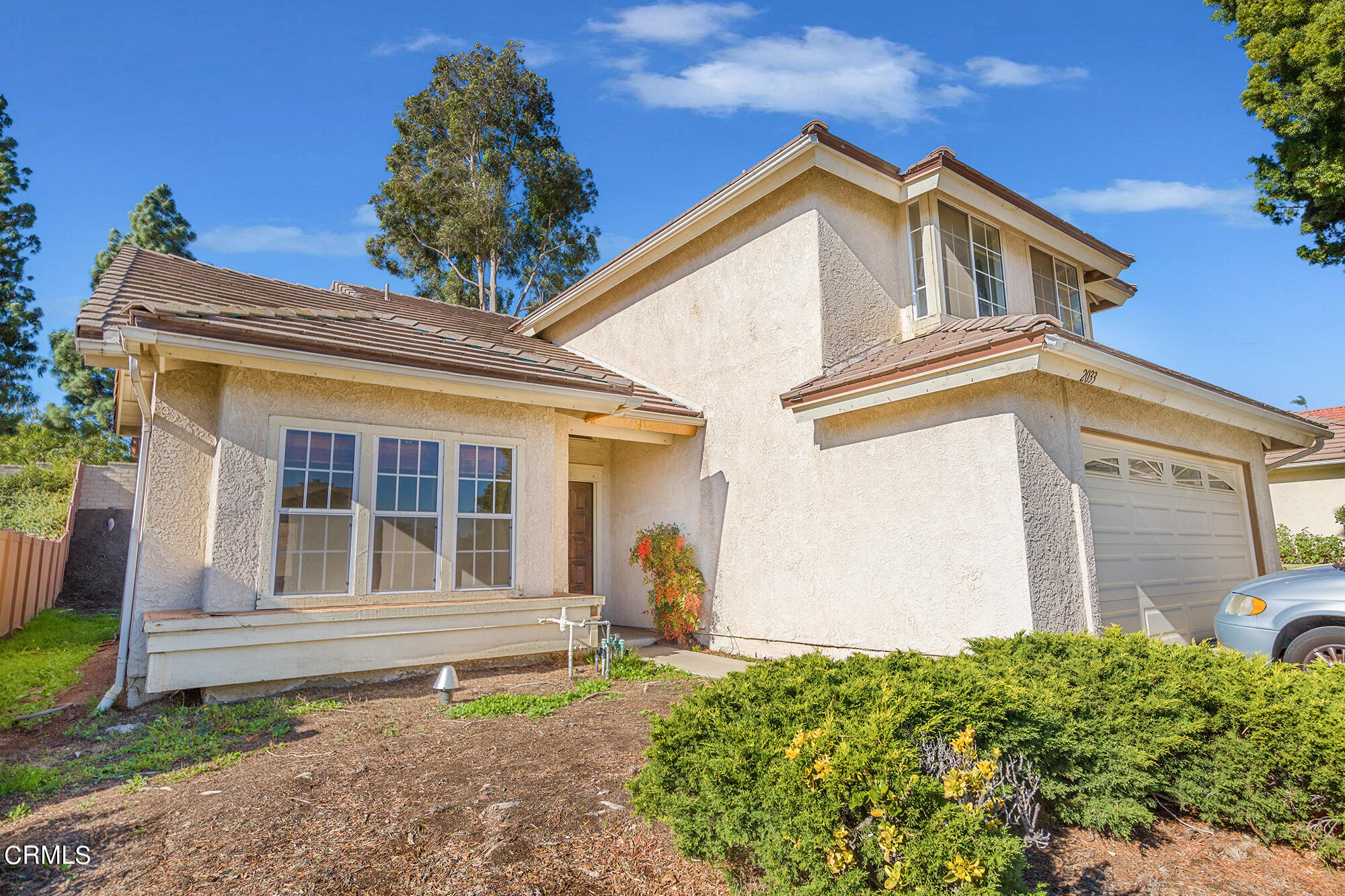 2033 Old Ranch Road Camarillo, CA 93012 - Photo 1 of 18 a front view of a house with garden