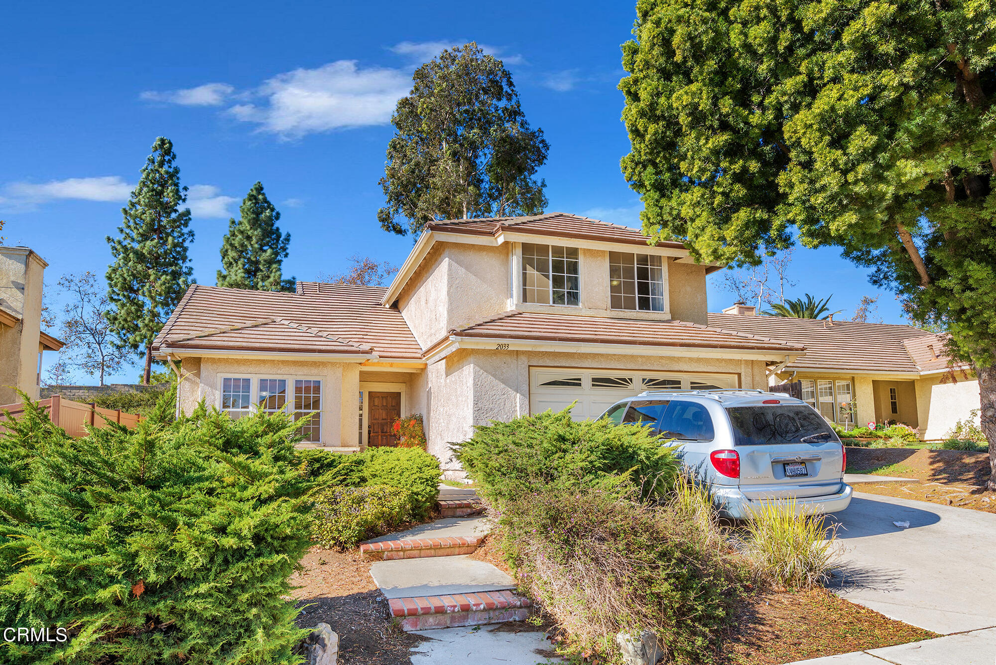 2033 Old Ranch Road Camarillo, CA 93012 - Photo 2 of 18 a front view of a house with a garden