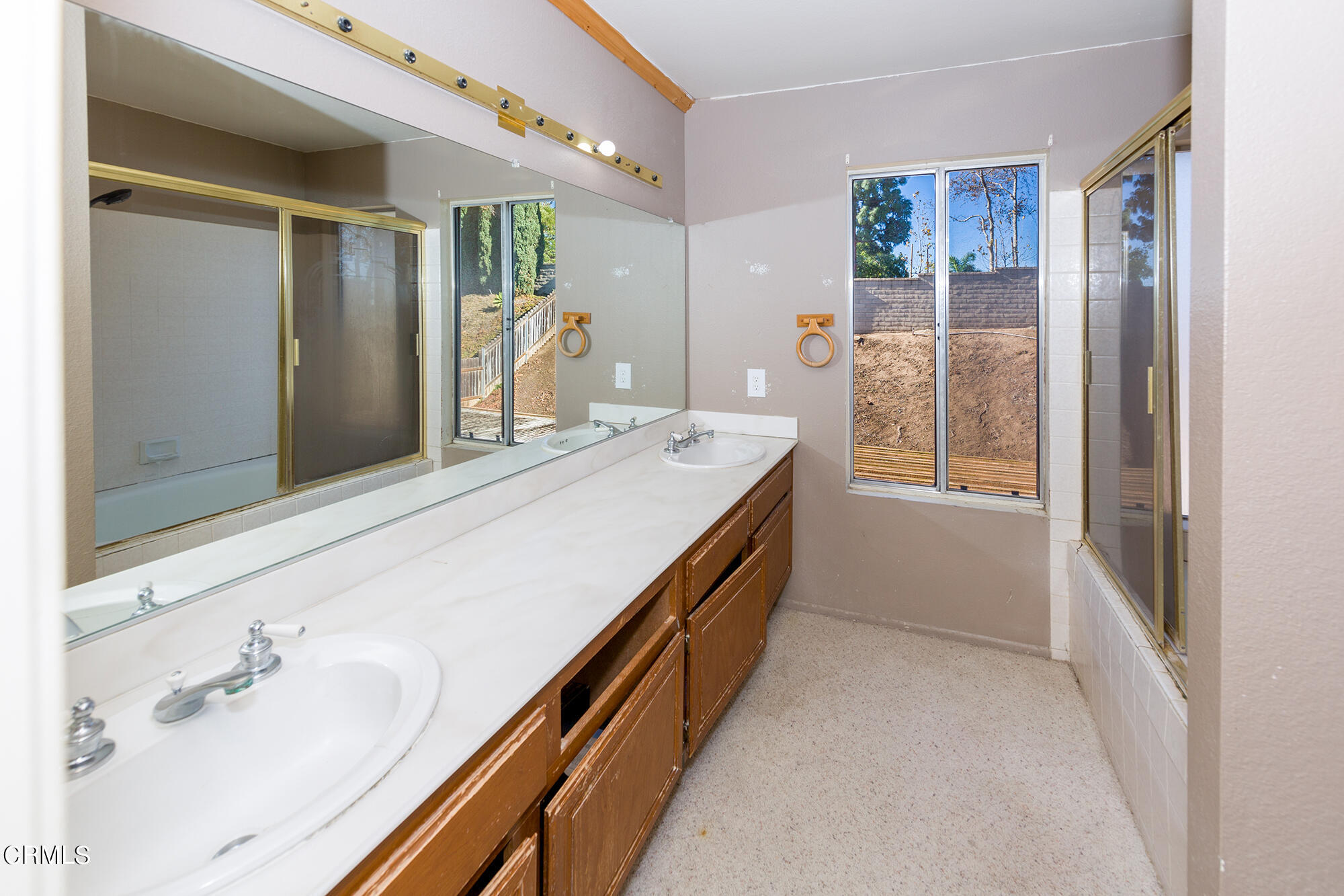 2033 Old Ranch Road Camarillo, CA 93012 - Photo 12 of 18 a bathroom with a double vanity sink a mirror and a shower
