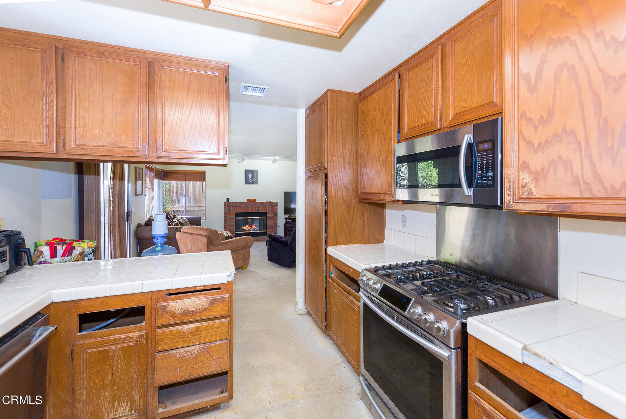 2033 Old Ranch Road Camarillo, CA 93012 - Photo 6 of 18 a kitchen with stainless steel appliances granite countertop a stove top oven a sink dishwasher and cabinets with wooden floor