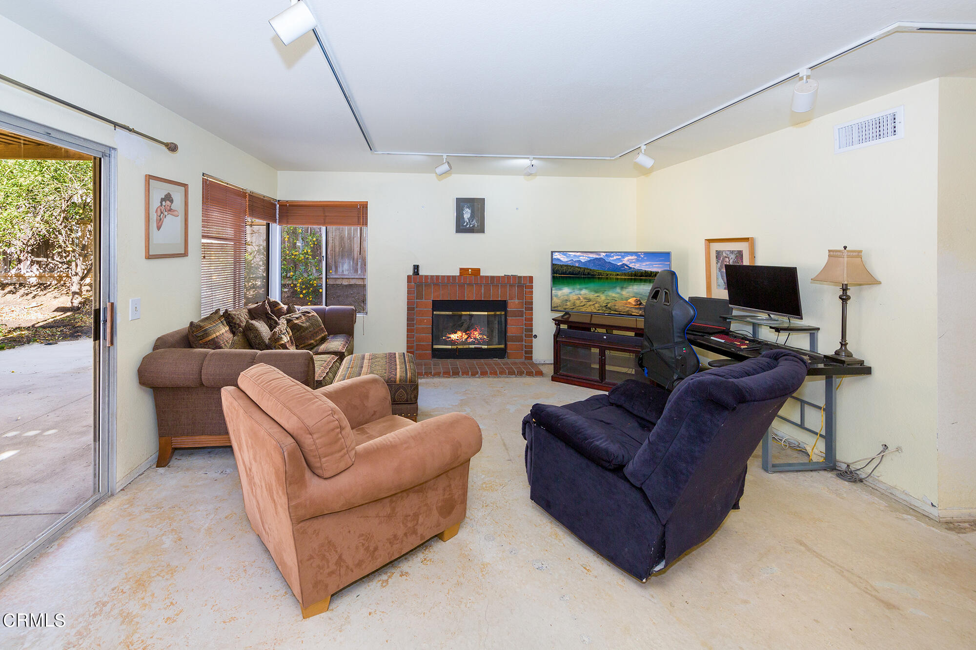 2033 Old Ranch Road Camarillo, CA 93012 - Photo 7 of 18 a living room with furniture a large window and a flat screen tv