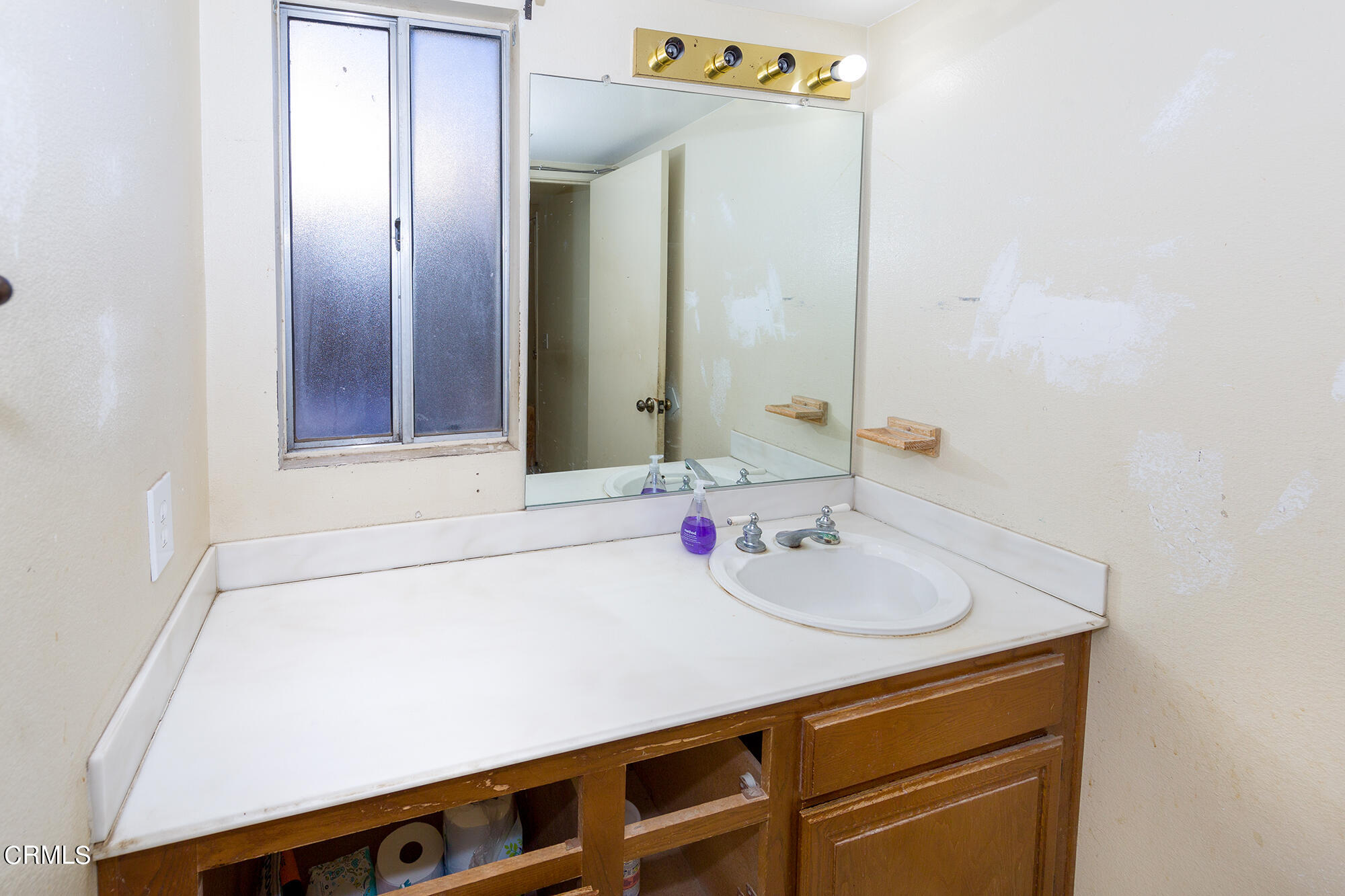 2033 Old Ranch Road Camarillo, CA 93012 - Photo 9 of 18 a bathroom with a sink and a mirror
