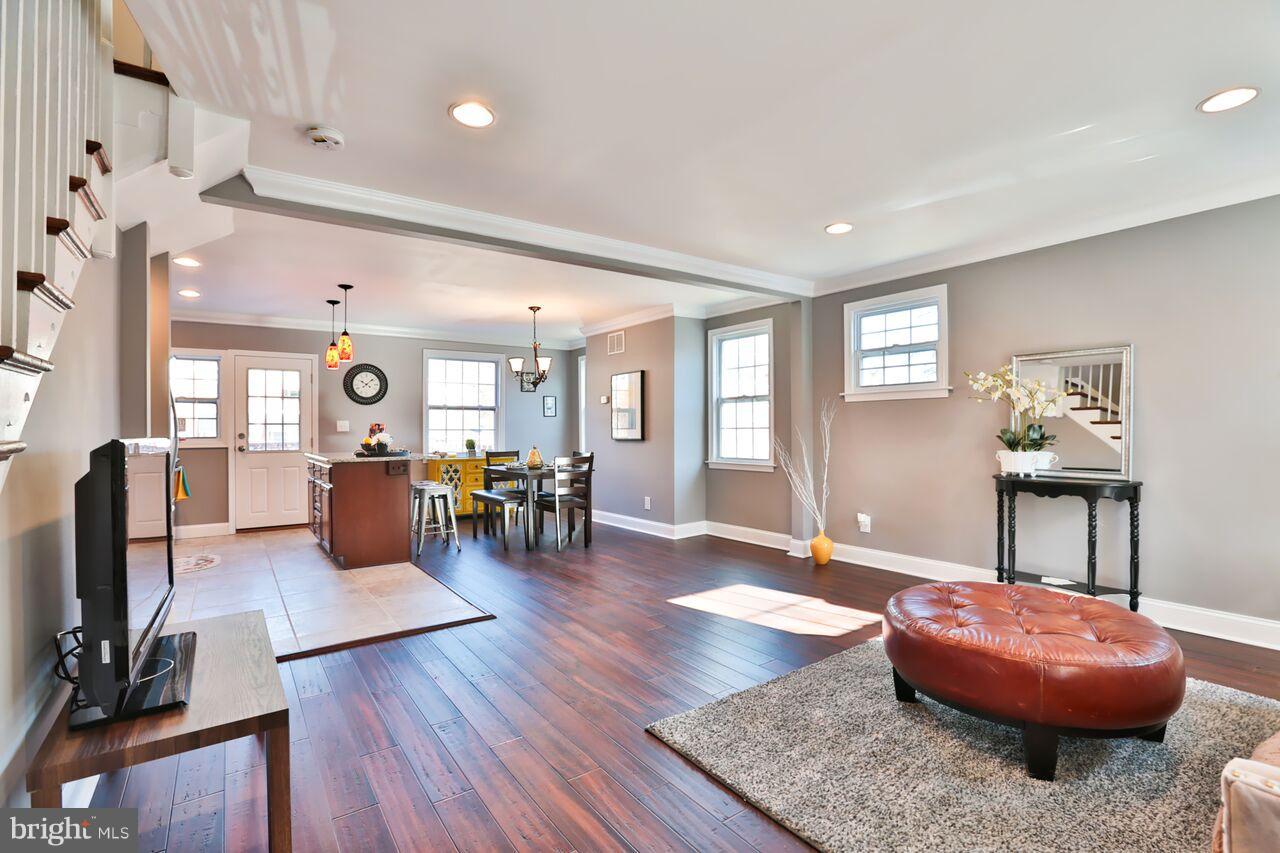 5136 Stafford Road Baltimore, MD 21229 - Photo 9 of 30 a living room with furniture and wooden floor