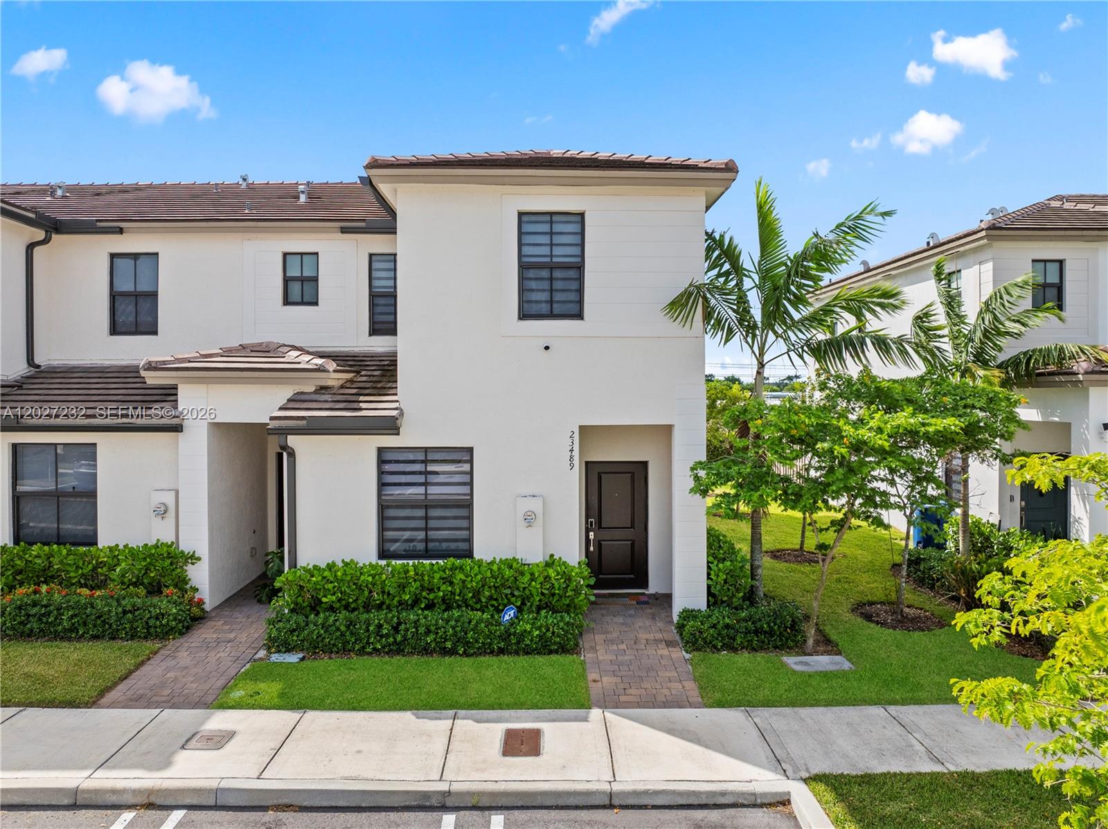23489 Southwest 127th Place Homestead, FL 33032 - Photo 1 of 24 a house view with a garden space