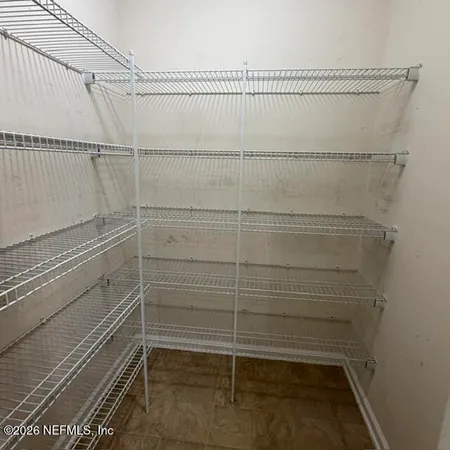 a view of a room with racks on the wall